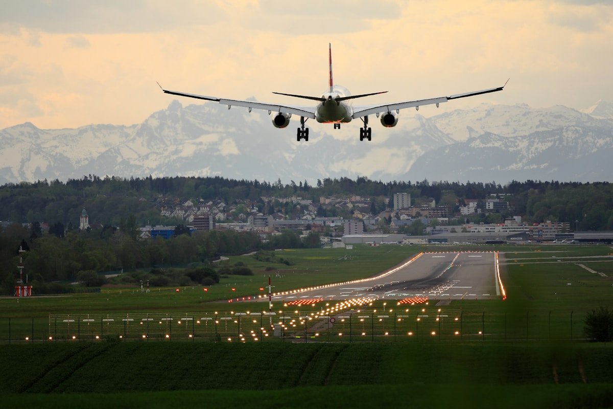 Commercial aircraft on tarmac at dusk
